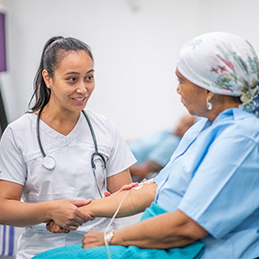 nurse taking patient pulse