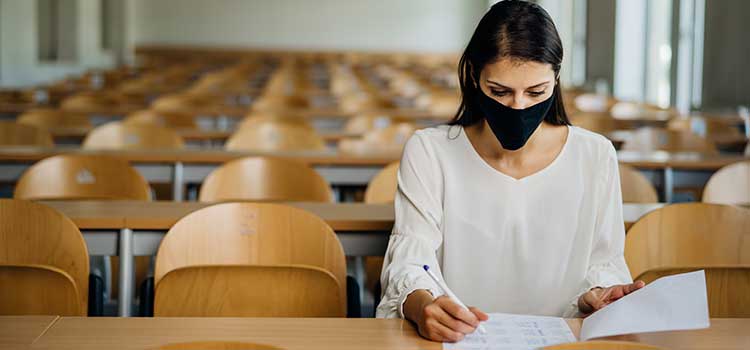 woman studying in empty classroom