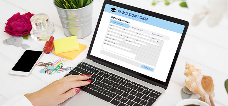 admission form being displayed on laptop computer
