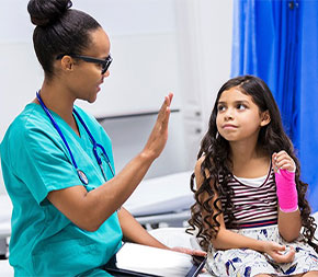 nurse meeting with patient and mother in medical facility