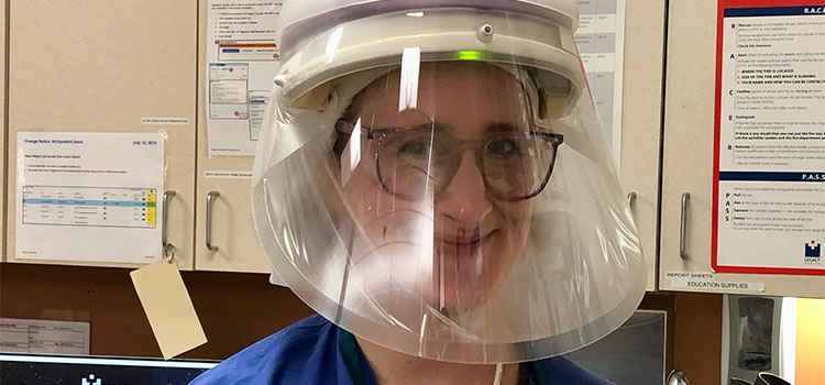 kathryn dailey-deaton wearing personal protection visor in hospital room