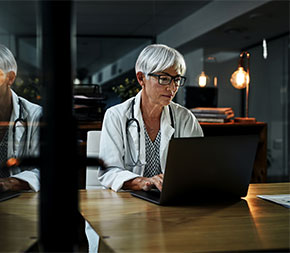 medical worker studying on laptop computer