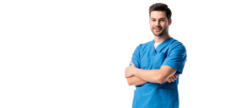 male nurse standing in front of a white background