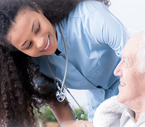 female nurse works with elderly patient