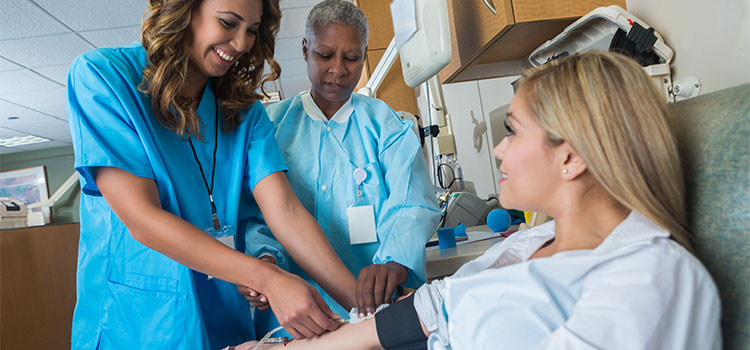 nurse being trained in clinical setting