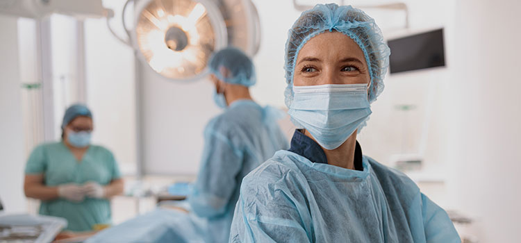 operating room nurse in mask ready for surgery