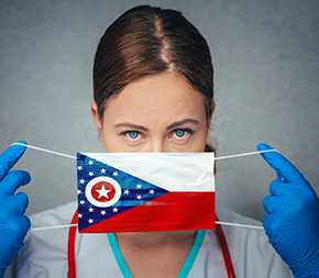 nurse putting on ohio flag mask