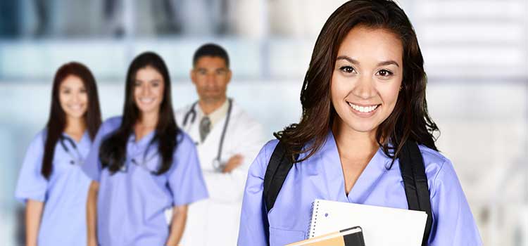nurse holds school books with trio of diverse nurses behind her